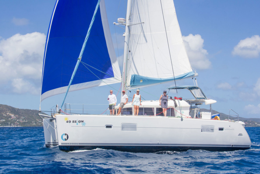 Crew aboard sailing catamaran